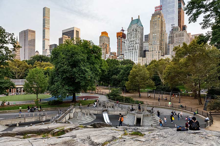 People skateboarding on rocks in city park. People skateboarding on rocks in city park.